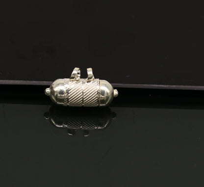 Solid sterling silver round amulet box pendant with tribal design, featuring a mantra box and intricate craftsmanship.