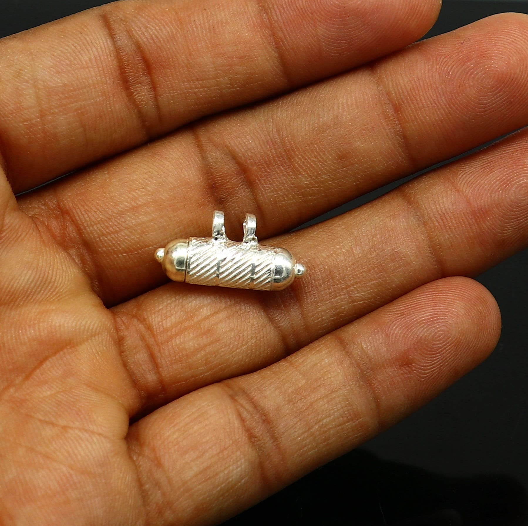 Solid sterling silver handmade round vintage amulet box pendant with tribal tribal jewelry design and engraved symbols.