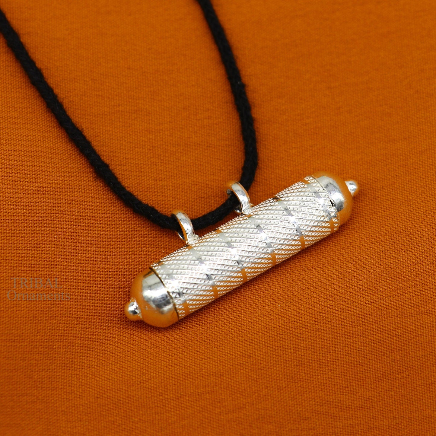 Solid sterling silver round amulet box pendant with intricate design, handmade mantra box and tribal jewelry style.