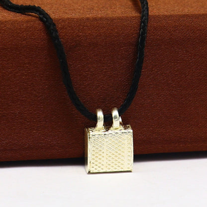 Solid sterling silver square amulet box pendant with intricate handmade design, mantra box, tribal style jewelry.