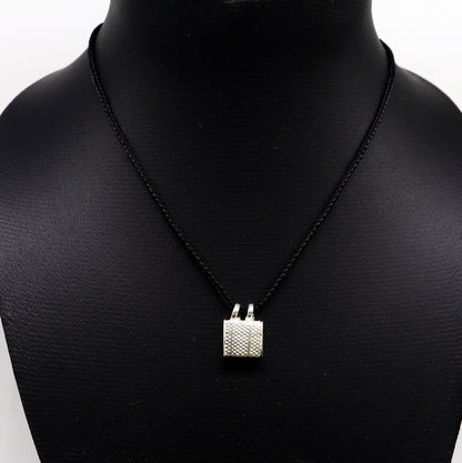 Solid sterling silver square amulet box pendant with engraved designs, handmade tribal ornament with mantra and kavacham motifs.