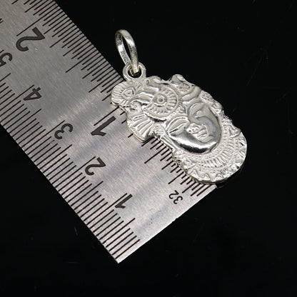 Solid sterling silver Lord Krishna Shreenathji tiny pendant from Tribal Ornaments, handmade Hindu jewelry, unisex gift accessory.