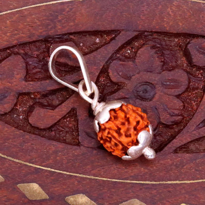 Solid sterling silver Rudraksha pendant from Tribal Ornaments, unisex handmade jewelry with intricate design and lightweight finish.