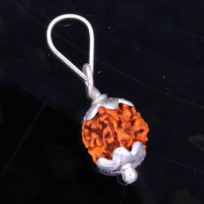 Solid sterling silver Rudraksha pendant from TRIBAL ORNAMENTS, handcrafted unisex jewelry with intricate detailing for gifting.