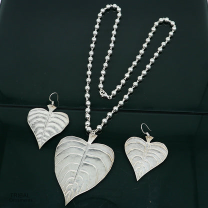 Sterling silver tribal jewelry set featuring a vintage Peepal tree leaf pendant with beaded necklace, handcrafted ethnic design.