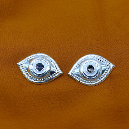 Solid sterling silver Netra eyes for Lord Jagannath and Laddu Gopala idols, featuring intricate white craftsmanship by TRIBAL ORNAMENTS.