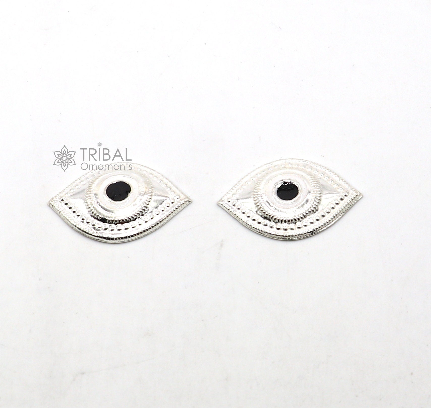 Solid sterling silver Netra eyes for Lord Jagannath and Laddu Gopala idols, crafted by TRIBAL ORNAMENTS.