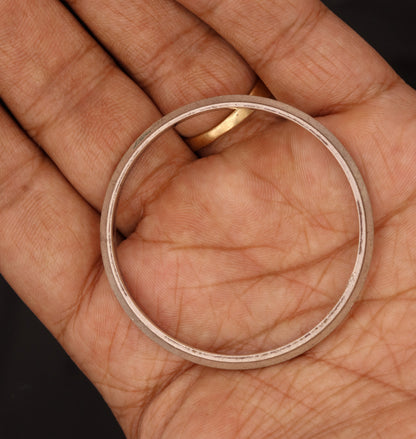 Vintage handmade baby kada bracelet from India, antique Punjabi Sikhha bangle in solid metal with intricate tribal ornament design.