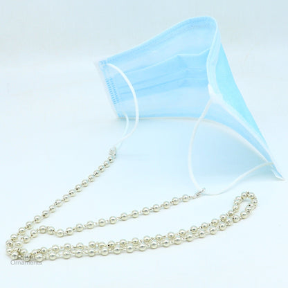 Sterling silver face mask and eyeglass chain necklace for women, stylish and functional accessory with a tribal ornament design.