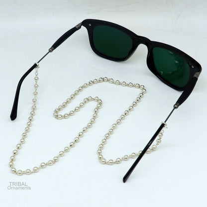 Sterling silver face mask and eyeglass chain necklace for women, stylish tribal ornament design with glasses and mask attachment.