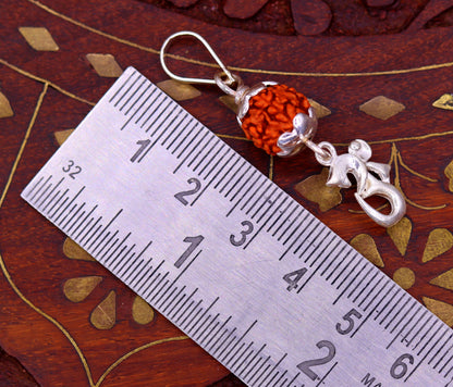 Sterling silver unisex necklace with Aum symbol and natural rudraksha pendant, handmade tribal jewelry by TRIBAL ORNAMENTS.