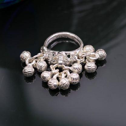 Sterling silver handmade charm ring with noisy bells, tribal antique jewelry for belly dance, featuring intricate tribal design from India.