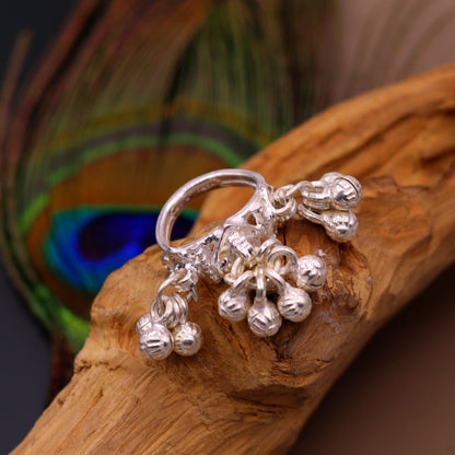 Sterling silver handmade charm ring with noisy bells, tribal antique jewelry for belly dance, featuring intricate tribal design from India.