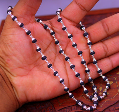 Sterling silver handmade black basil rosary necklace with wooden beads and silver chain, ideal for Ayurveda meditation and spiritual practice.