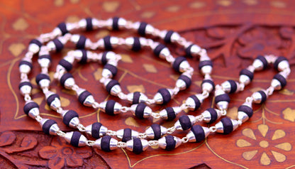Sterling silver handmade basil rosary necklace with black wooden beads and silver chain, ideal for Ayurveda meditation and prayer.