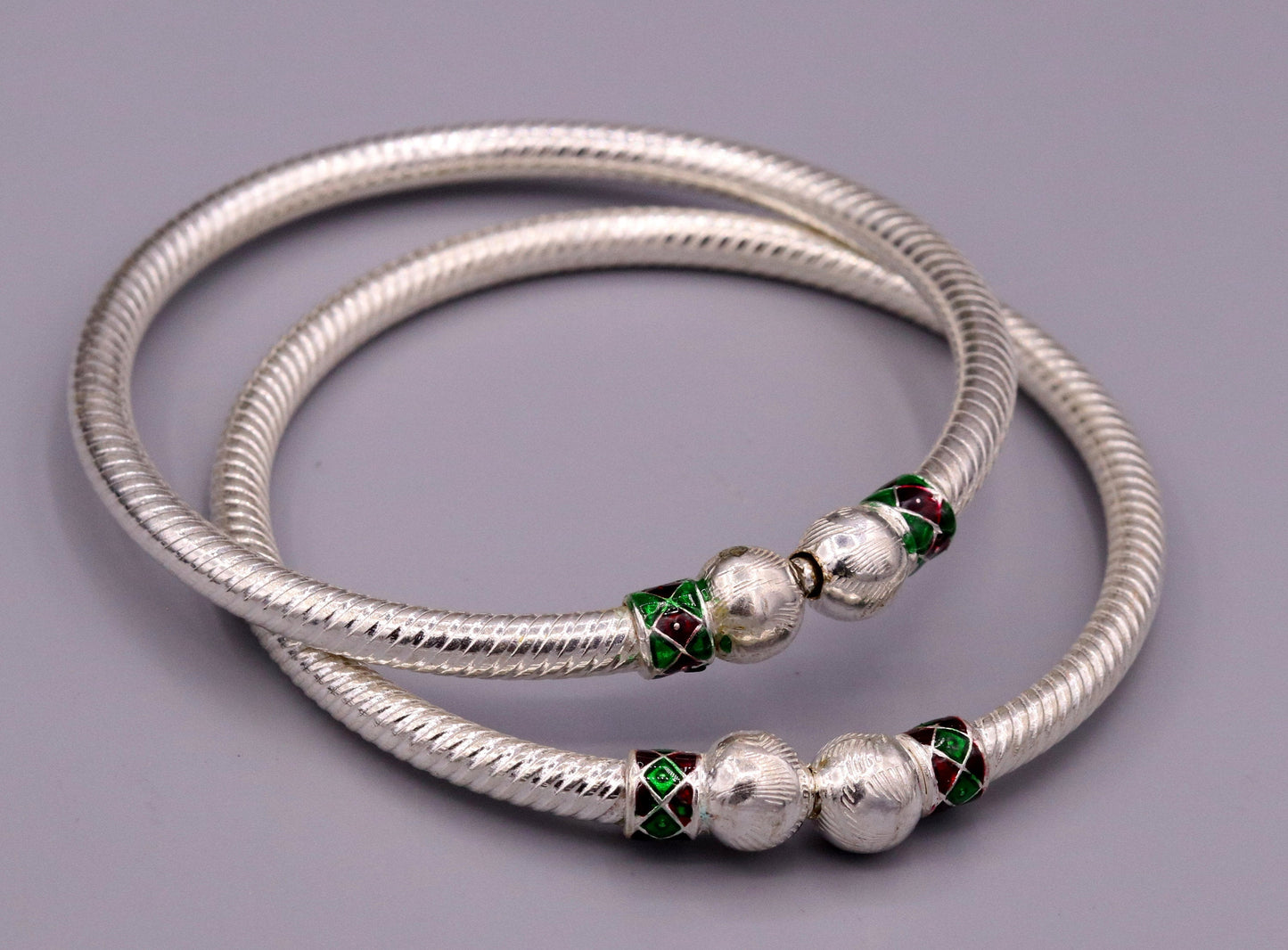 Pair of sterling silver handmade vintage tribal bangle bracelets from Rajasthan, featuring antique design for belly dance jewelry.