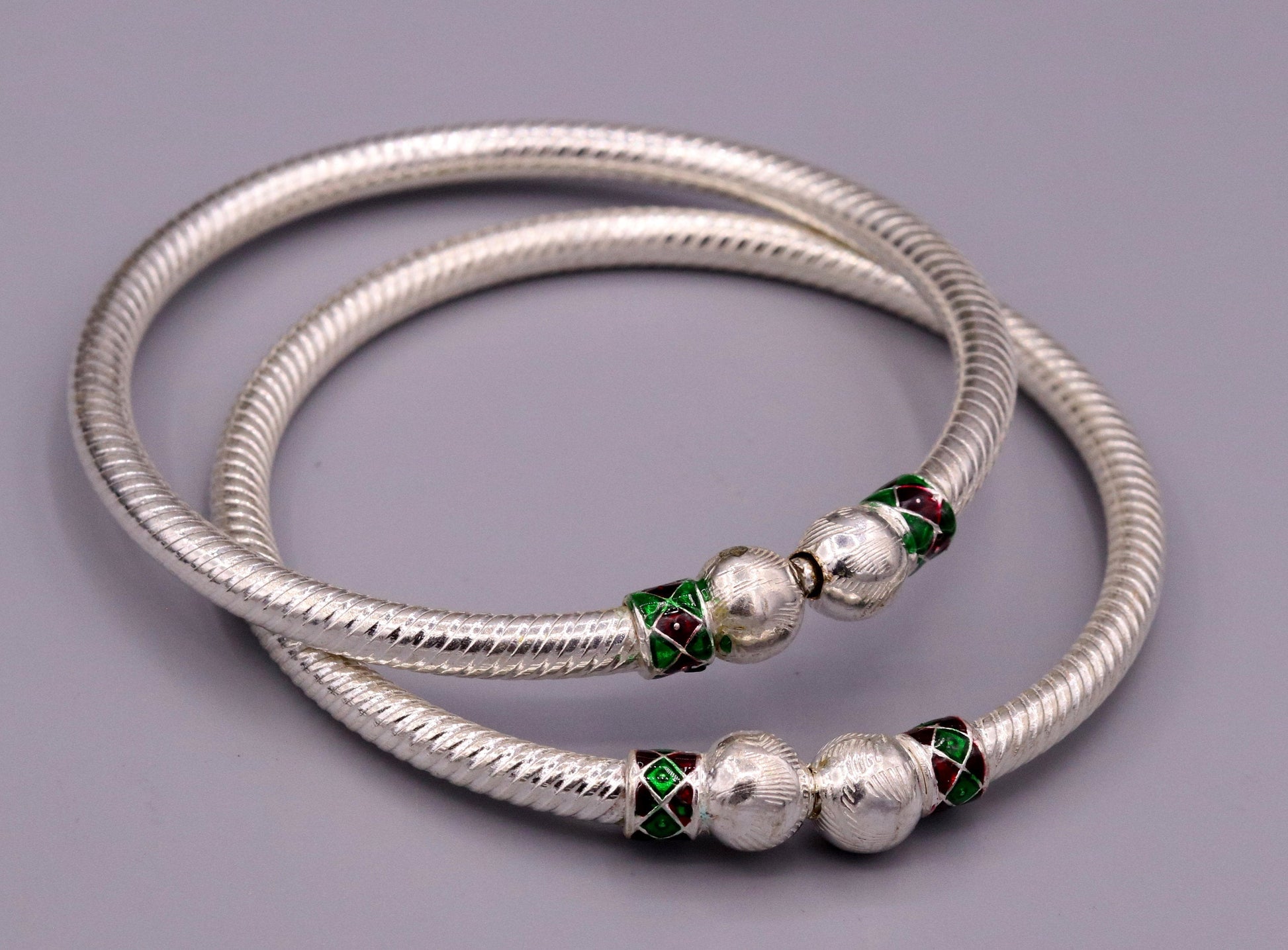 Pair of sterling silver handmade vintage tribal bangle bracelets from Rajasthan, featuring antique design for belly dance jewelry.