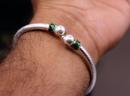 Pair of handmade sterling silver vintage bangle bracelets with tribal antique design from Rajasthan, India, for belly dance jewelry.