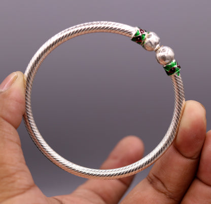 Pair of vintage tribal sterling silver bangles with antique design, handcrafted belly dance jewelry from Rajasthan, India.
