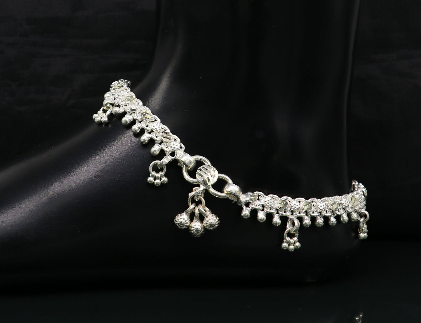 Sterling silver tribal ankle bracelet with vintage custom design, featuring intricate antique-style patterns and genuine jewelry craftsmanship.