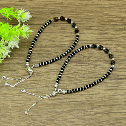 Sterling silver beaded bracelet with black onyx stone and Nazariya charm, adjustable jewelry by TRIBAL ORNAMENTS for girls.