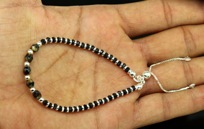 Sterling silver beaded bracelet with black onyx stone and Nazariya charm, adjustable jewelry for girls by TRIBAL ORNAMENTS.