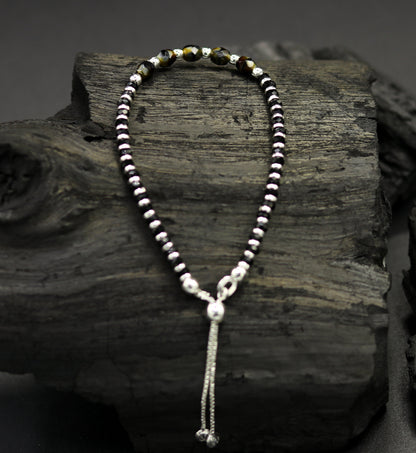 Sterling silver beaded bracelet with black onyx stone and Nazariya charm, adjustable jewelry for girls by TRIBAL ORNAMENTS.