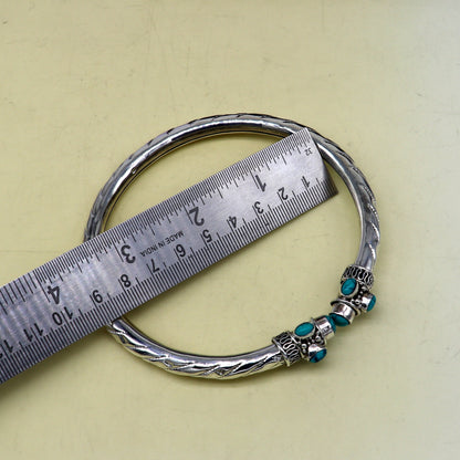 Stylish customized ankle kada bracelet with turquoise stone, tribal ornaments, perfect for brides and wedding gifting.