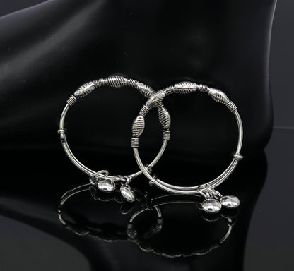 Sterling silver designer baby adjustable bangle bracelet with charming charms, handmade by Tribal Ornaments for kids jewelry.