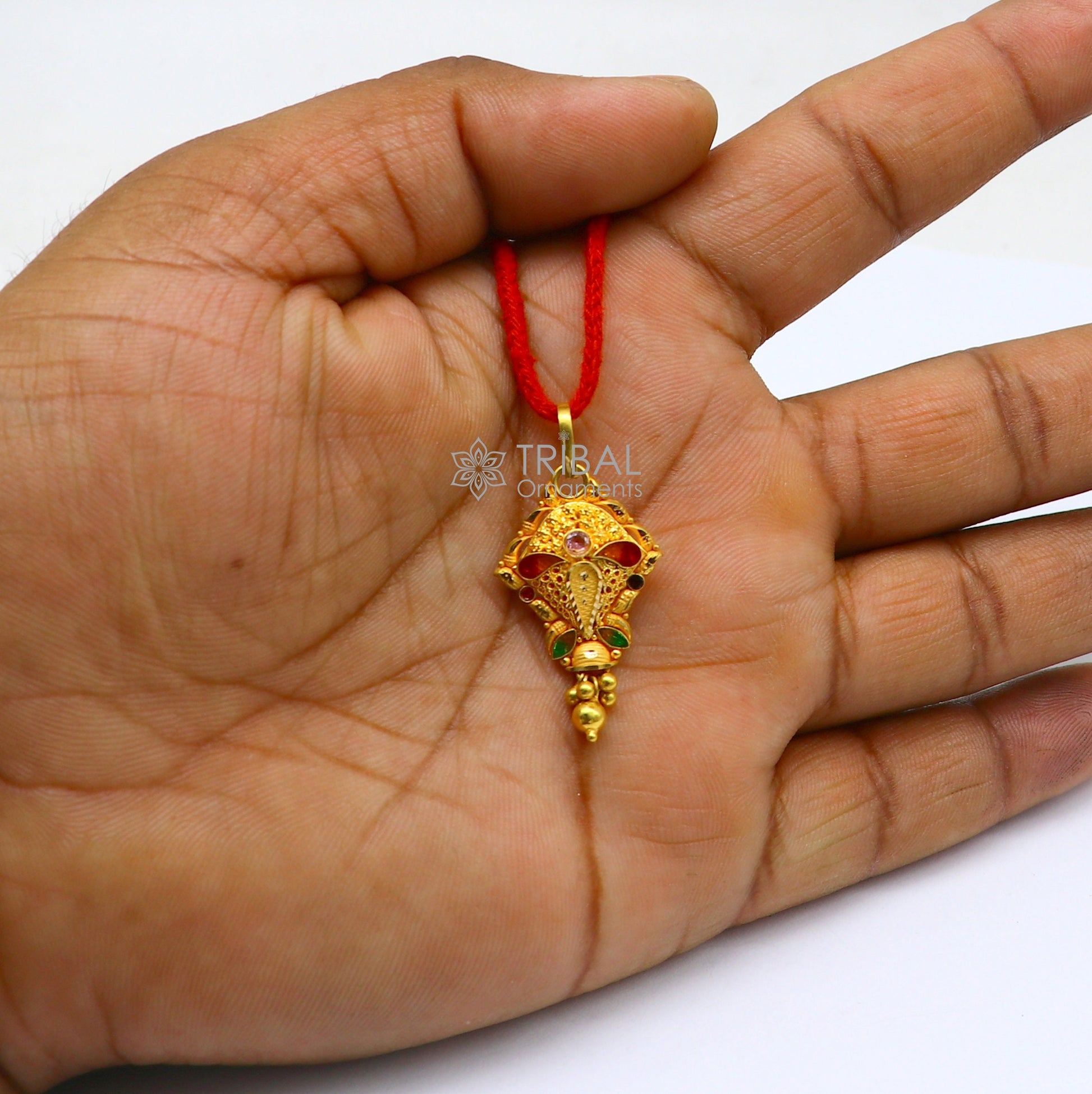Traditional 22KT yellow gold filigree work pendant from TRIBAL ORNAMENTS, showcasing intricate ethnic bridal jewelry design.