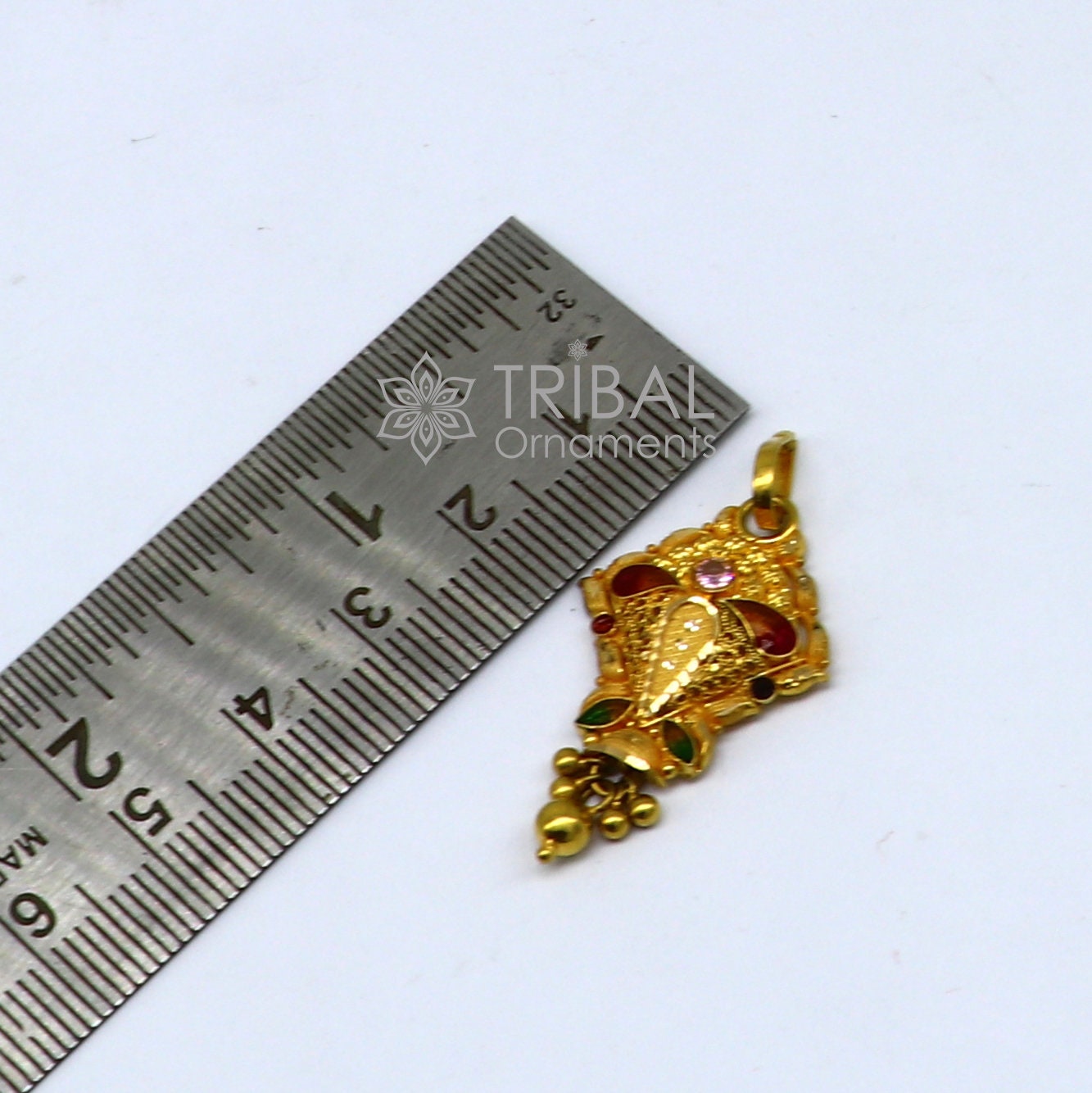 Traditional 22KT yellow gold filigree pendant from TRIBAL ORNAMENTS, showcasing ethnic bridal jewelry design.