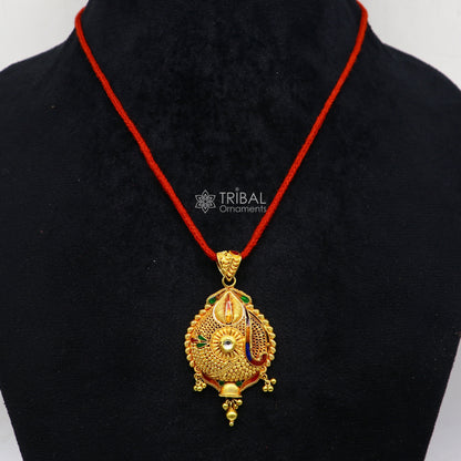 Traditional 22KT yellow gold filigree pendant by TRIBAL ORNAMENTS, showcasing intricate handmade ethnic bridal jewelry design.