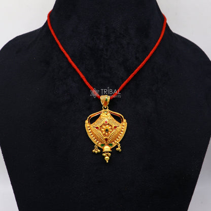 Traditional 22KT yellow gold filigree pendant by TRIBAL ORNAMENTS, showcasing intricate handmade ethnic bridal jewelry design.