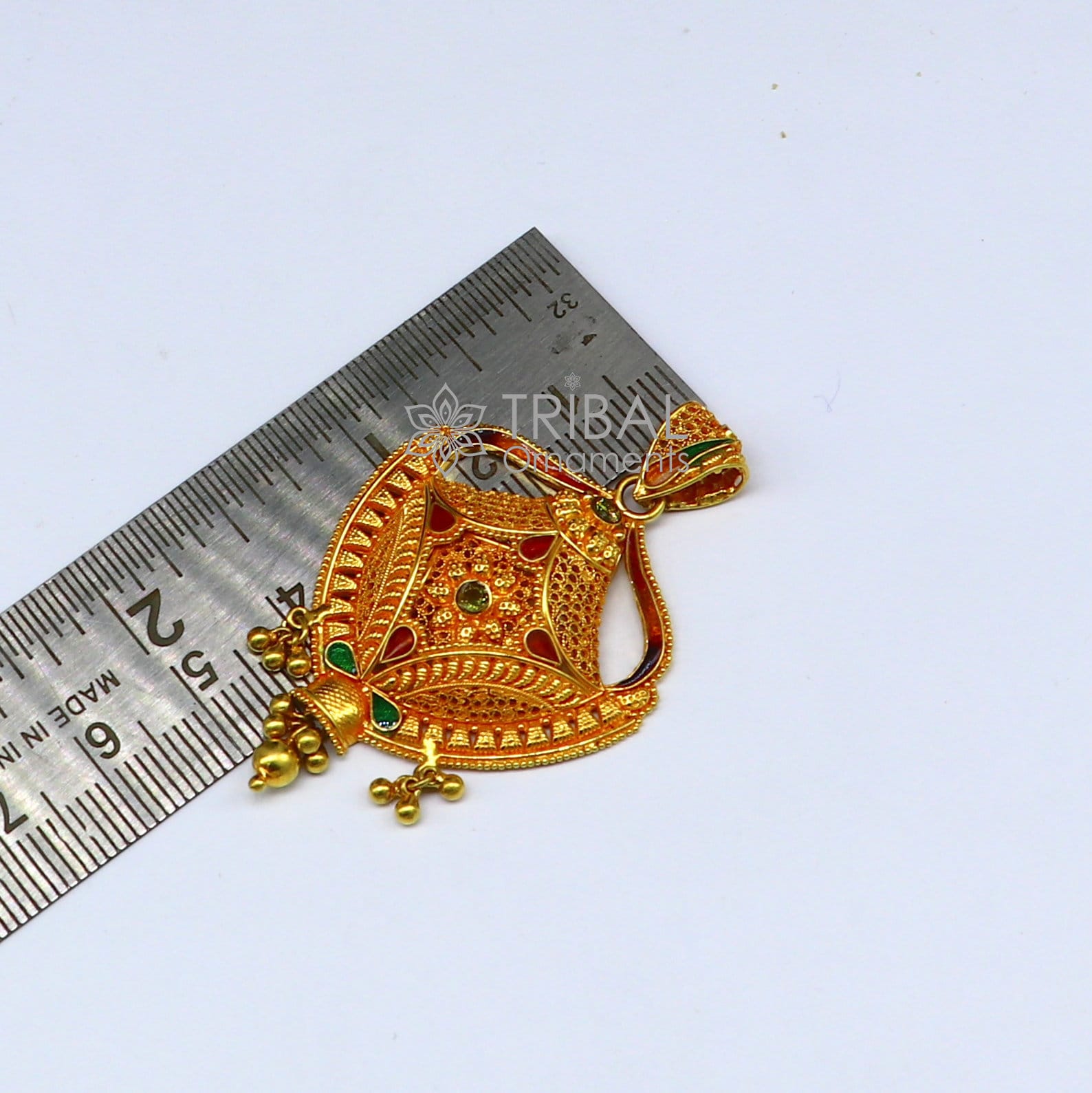 Traditional 22KT yellow gold filigree pendant by TRIBAL ORNAMENTS, showcasing intricate handmade ethnic bridal jewelry design.