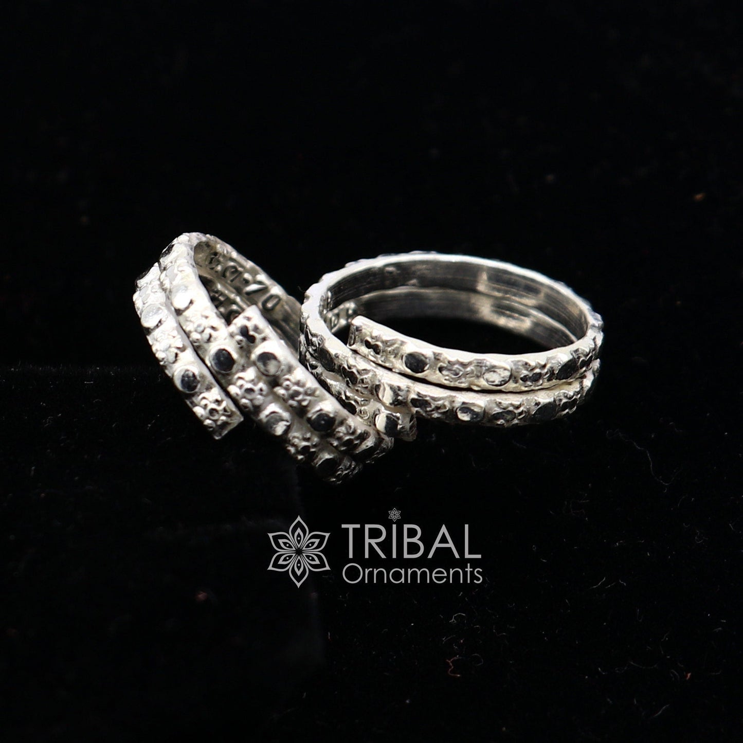 Traditional Indian tribal silver toe ring with handmade spiral design, showcasing cultural style and intricate craftsmanship.