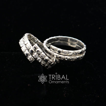 Traditional Indian tribal silver toe ring with handmade spiral design, showcasing cultural style and intricate craftsmanship.