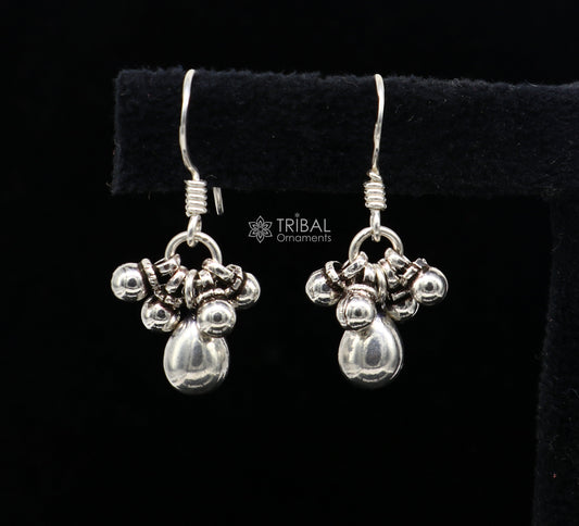 Traditional tribal-inspired 925 sterling silver hoops earrings with hanging drop design, custom and trendy tribal jewelry.