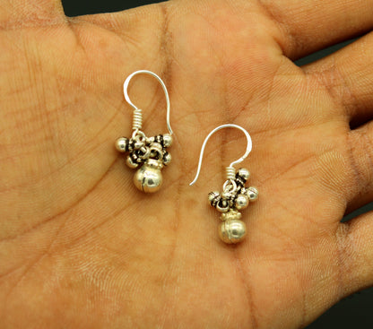 Traditional design 925 sterling silver hoops earrings with hanging bell dangles, tribal-inspired jewelry by TRIBAL ORNAMENTS.