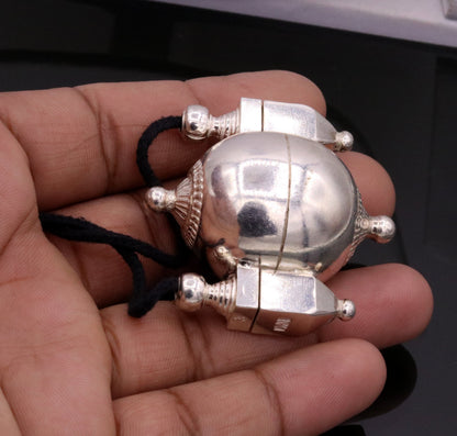 Handmade silver Shiva Lingam pendant with tribal design, prayer box, and mantra holder from Rajasthan tribal jewelry collection.