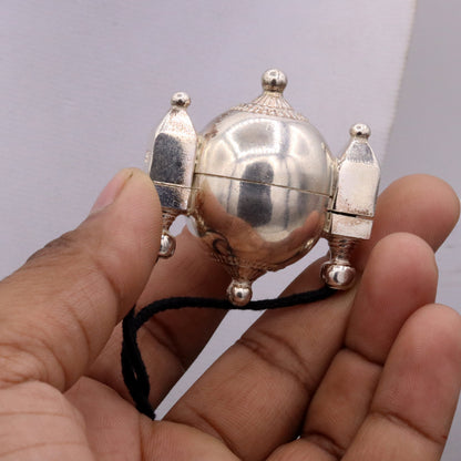 Handmade silver Shiva Lingam amulet pendant with traditional tribal design, prayer box jewelry from Rajasthan, India.
