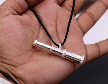 Traditional tribal sterling silver pendant featuring antique-style unisex design from Rajasthan, India, with intricate detailing.