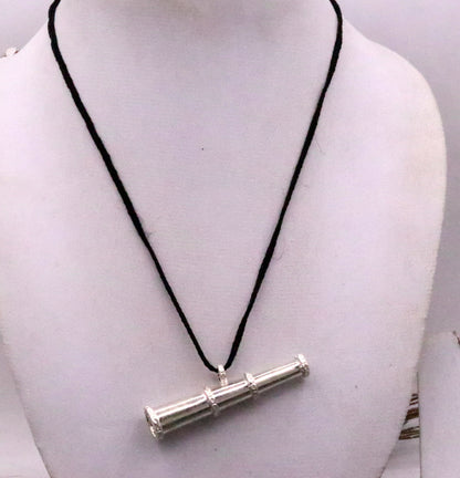 Traditional tribal-style sterling silver unisex pendant featuring intricate design, suitable for gifting, from Rajasthan, India.