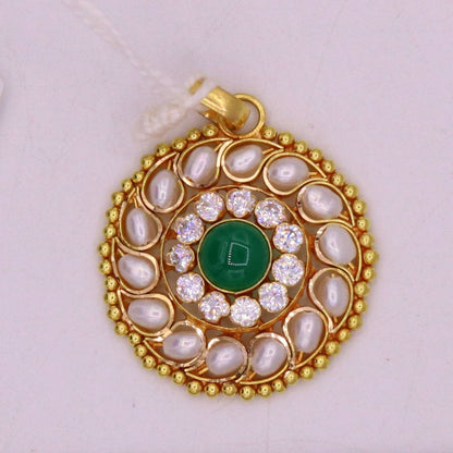 Vintage 22K yellow gold pendant with white pearl and green stone in Jadau style, handcrafted Indian jewelry with intricate design.