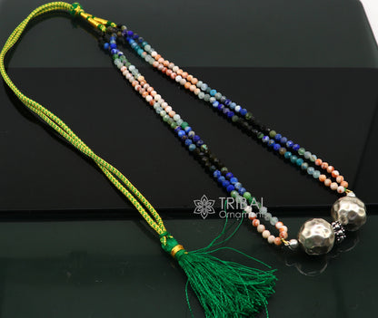 Colorful Indian tribal beaded sterling silver pendant necklace with ball charms, styled as a choker with ethnic jewelry elements.