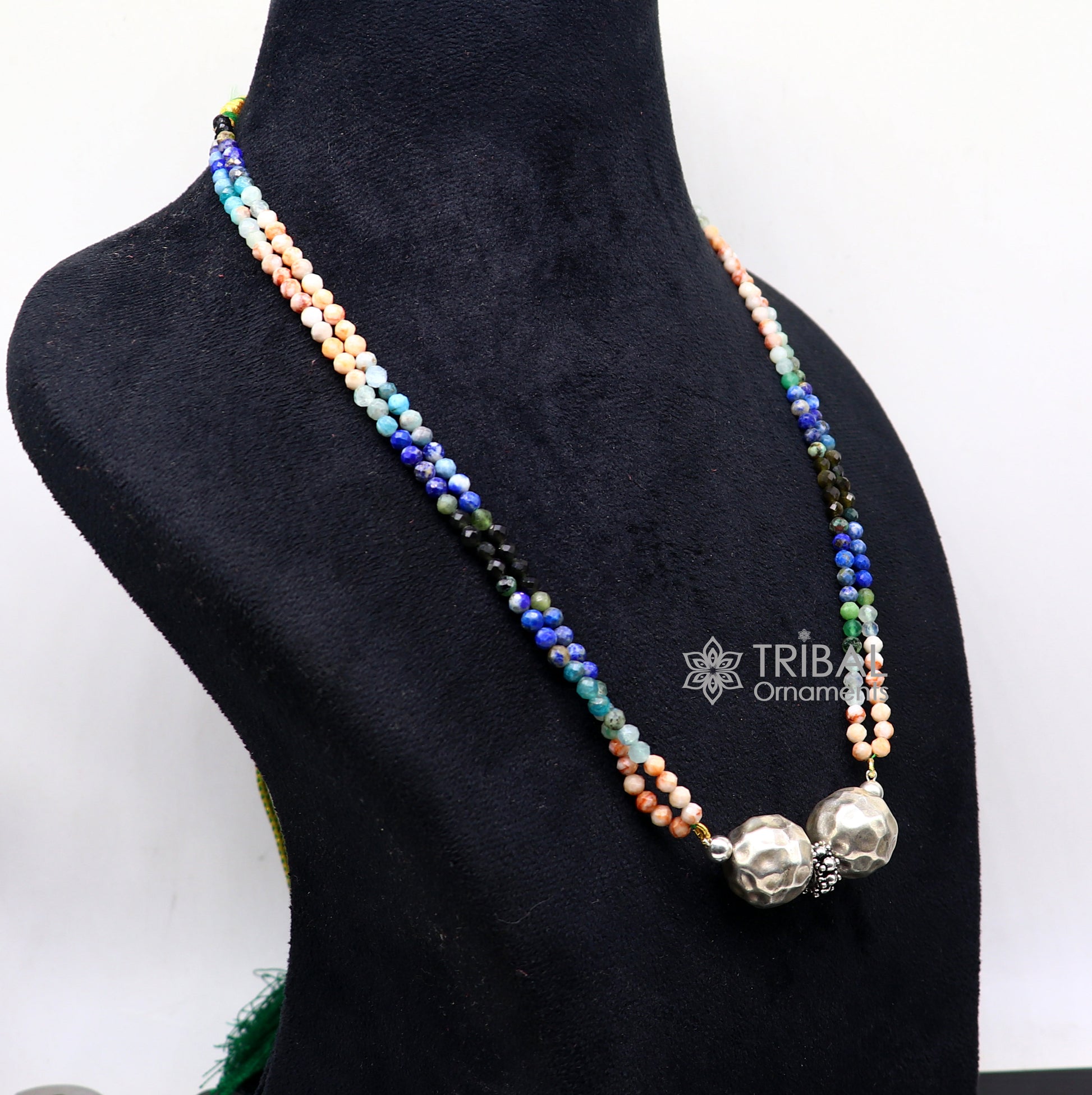 Colorful Indian tribal beaded necklace with sterling silver ball pendant, featuring multicolor stones and ethnic design.