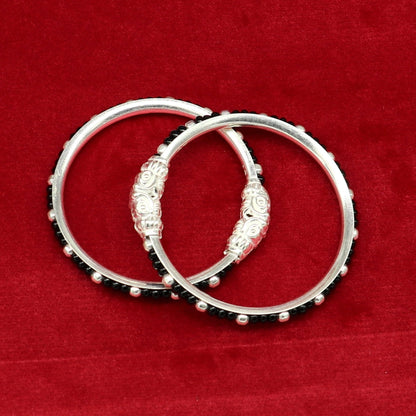 Sterling silver baby bangle with black evil eye design, trendy tribal jewelry for newborns and kids from TRIBAL ORNAMENTS.