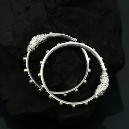 Trendy sterling silver baby bangle with black evil eye design, tribal ornaments brand, suitable for newborns and kids, Indian-inspired jewelry