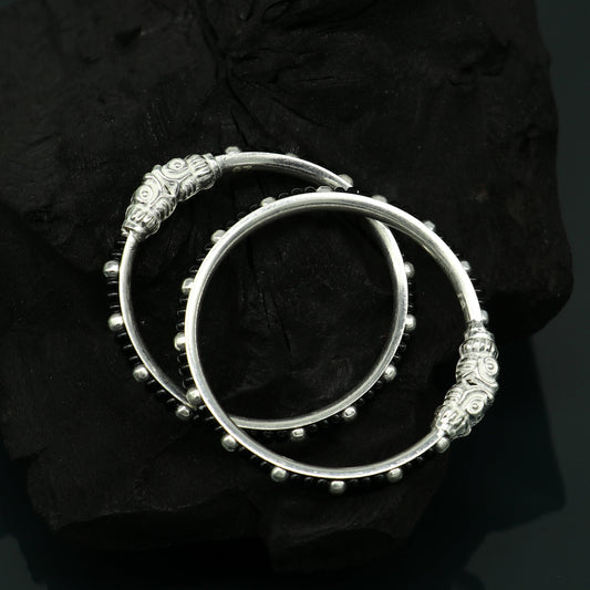 Trendy sterling silver baby bangle with black evil eye design, tribal ornaments brand, suitable for newborns and kids, Indian-inspired jewelry