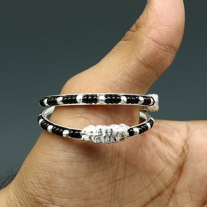 Sterling silver baby bangle with black evil eye design by TRIBAL ORNAMENTS, perfect for newborns and kids, Indian baby jewelry.