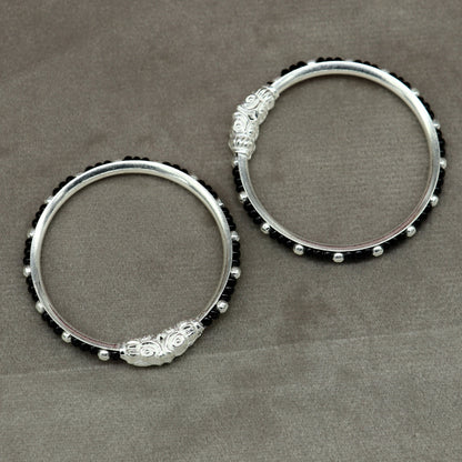 Sterling silver baby bangle with black evil eye design, tribal style jewelry for newborns and kids from Tribal Ornaments.